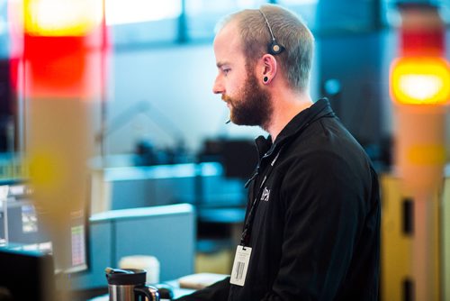 MIKAELA MACKENZIE / WINNIPEG FREE PRESS
Luke Moore, police communications operator, at the Winnipeg Police Service communications centre in Winnipeg on Monday, Oct. 1, 2018.  Winnipeg Free Press 2018.