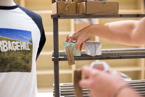 MIKAELA MACKENZIE / WINNIPEG FREE PRESS
Melissa Penner of Made Here sets up items, which will be opening at the Portage and Main Concourse this Thursday, displays products from local makers and artisans with a portion of proceeds going to children's charities in Winnipeg on Wednesday, Oct. 3, 2018.  Winnipeg Free Press 2018.