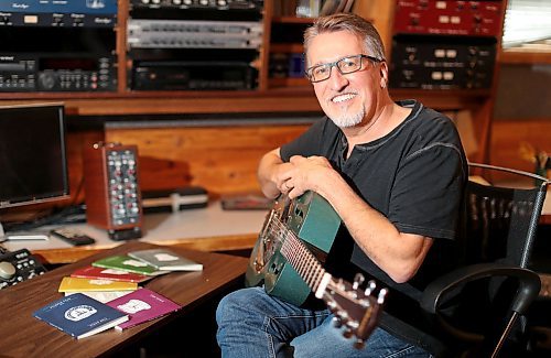 TREVOR HAGAN / WINNIPEG FREE PRESS
Singer/Songwriter Steve Bell in his studio, with his series of books, Wednesday, October 3, 2018. for Brenda Suderman