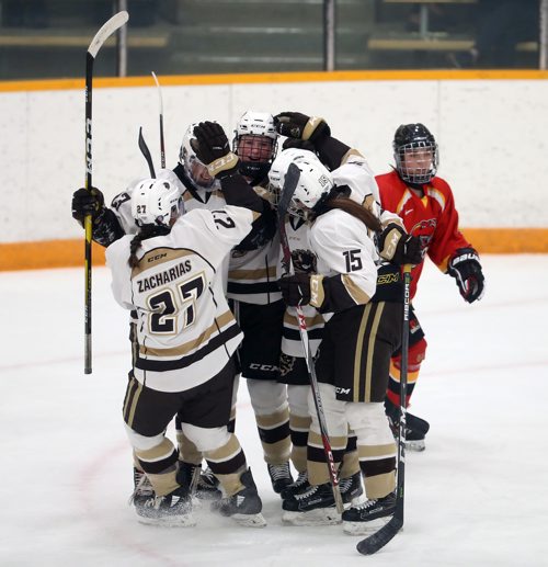 TREVOR HAGAN / WINNIPEG FREE PRESS 
The 2017-2018 Manitoba Bisons' women hockey championship banner is unveiled prior to the game against the Calgary Dinos, Friday, October 5, 2018.