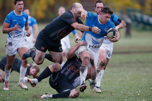 JOHN WOODS / WINNIPEG FREE PRESS
University of Manitoba Wombats' Justin Rak-Banville (1) and Tom McKee (10) attempt to haul down Assassins' Bobby MacKay (1) in the Manitoba Men's Rugby Division 1 Championship game Saturday, October 6, 2018. The Wombats went on to defeat the Assassins.
