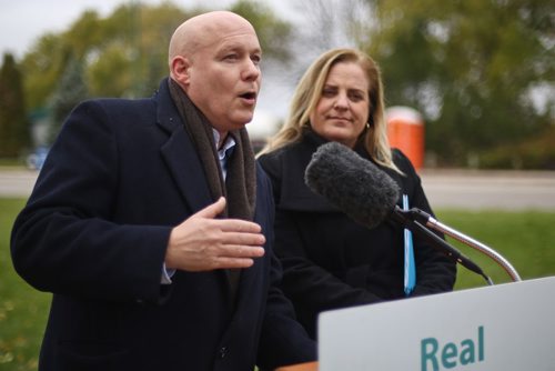 MIKE DEAL / WINNIPEG FREE PRESS

Incumbent Winnipeg councillor for the Elmwood - East Kildonan Ward, Jason Schreyer, declares that he voted early for mayoral candidate Jenny Motkaluk at an infrastructure announcement Motkaluk was making about making the Louise Bridge replacement a major priority if she was elected. 
181009 - Monday, October 9, 2018