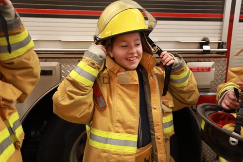 RUTH BONNEVILLE / WINNIPEG FREE PRESS

Standup photo

Grade six student, Bailey Hatch, tries on firefighter gear at Number 11 Fire Station along with their classmates from Hedge Middle School, Thursday.  The outing was in honour of the International Day of the Girl which was being recognized by the Winnipeg Fire Paramedic Service (WFPS) partnered with the Government of Manitobas Status of Women which hosted groups of Winnipeg girls at four WFPS locations in Winnipeg.  The purpose of these visits was to ensure young girls know that careers in the Fire and Paramedic Service are within their grasp.


More Info below: 
Approximately 100 sixth grade girls from four Winnipeg schools had the opportunity to participate in WFPS station tours, ask questions to female responders and try their hand at a variety of drills and demonstrations, including learning about CPR, trying on firefighter turn out gear and learning stretcher and hose handling skills.

Today is International Day of the Girl, and this years theme centres around preparing girls for the workforce, said Manitoba Sustainable Development Minister Rochelle Squires, minister responsible for the status of women. This event reminds us that no career goal is off limits for girls, including the Winnipeg Fire and Paramedic Service. I hope the girls participating today have fun, make new friends and come away with greater confidence in their abilities.

Currently, within the WFPS firefighting ranks, approximately five per cent of staff identify as female. Within EMS, that number jumps to approximately 35 per cent. Research states that many young people start leaning towards their particular career interests by approximately 12 years old, which is why todays event is aimed at girls of this age.

Standup photo 

October 11, 2018