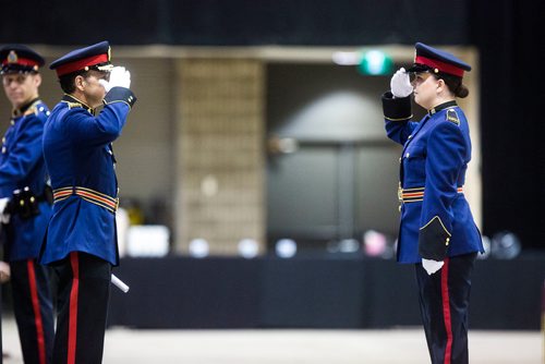 MIKAELA MACKENZIE / WINNIPEG FREE PRESS
Constable Brittany Goranson (right) salutes Chief Danny Smyth at the graduation ceremony for recruit class 161 and 161 lateral takes place at the RBC Convention Centre in Winnipeg on Friday, Oct. 12, 2018. 
Winnipeg Free Press 2018.