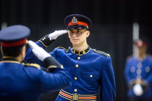 MIKAELA MACKENZIE / WINNIPEG FREE PRESS
Constable Jordan Vertone (right) salutes Chief Danny Smyth at the graduation ceremony for recruit class 161 and 161 lateral takes place at the RBC Convention Centre in Winnipeg on Friday, Oct. 12, 2018. 
Winnipeg Free Press 2018.