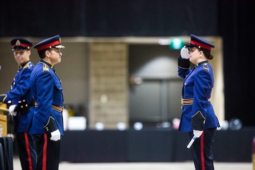 MIKAELA MACKENZIE / WINNIPEG FREE PRESS
Constable Brittany Goranson (right) salutes Chief Danny Smyth at the graduation ceremony for recruit class 161 and 161 lateral takes place at the RBC Convention Centre in Winnipeg on Friday, Oct. 12, 2018. 
Winnipeg Free Press 2018.