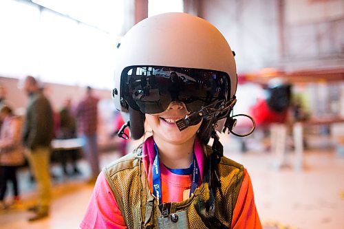 MIKAELA MACKENZIE / WINNIPEG FREE PRESS

Emma Wall tries on gear at aviation day at the Royal Aviation Museum of Western Canada in Winnipeg on Saturday, Oct. 13, 2018. 

Winnipeg Free Press 2018.