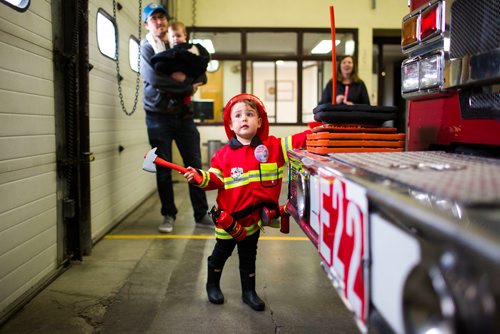 MIKAELA MACKENZIE / WINNIPEG FREE PRESS
Cohen Ateah, three, takes a look at the fire truck at station #22 on open fire hall day as part of fire prevention week in Winnipeg on Saturday, Oct. 13, 2018. 
Winnipeg Free Press 2018.
