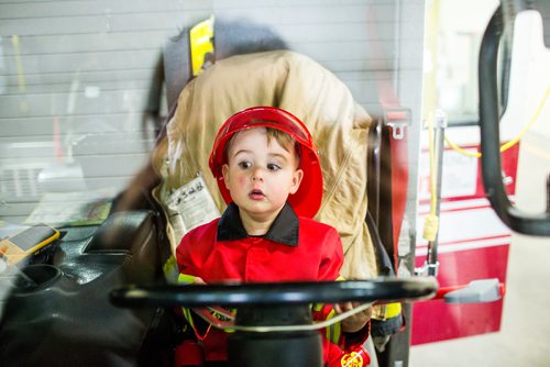 MIKAELA MACKENZIE / WINNIPEG FREE PRESS
Cohen Ateah, three, drives the fire truck at station #22 on open fire hall day as part of fire prevention week in Winnipeg on Saturday, Oct. 13, 2018. 
Winnipeg Free Press 2018.