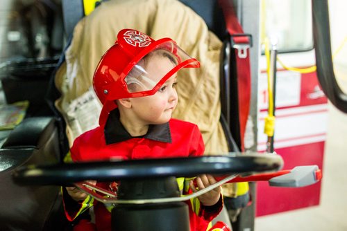 MIKAELA MACKENZIE / WINNIPEG FREE PRESS
Cohen Ateah, three, drives the fire truck at station #22 on open fire hall day as part of fire prevention week in Winnipeg on Saturday, Oct. 13, 2018. 
Winnipeg Free Press 2018.