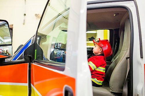 MIKAELA MACKENZIE / WINNIPEG FREE PRESS
Cohen Ateah, three, drives an ambulance at station #22 on open fire hall day as part of fire prevention week in Winnipeg on Saturday, Oct. 13, 2018. 
Winnipeg Free Press 2018.