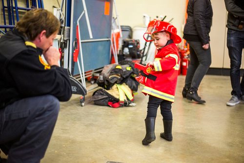 MIKAELA MACKENZIE / WINNIPEG FREE PRESS
Cohen Ateah, three, shows off his costume to captain John Grout at station #22 on open fire hall day as part of fire prevention week in Winnipeg on Saturday, Oct. 13, 2018. 
Winnipeg Free Press 2018.