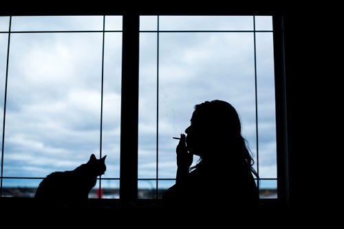 MIKAELA MACKENZIE / WINNIPEG FREE PRESS
A cannabis dealer smokes a joint in Winnipeg on Saturday, Oct. 13, 2018. 
Winnipeg Free Press 2018.