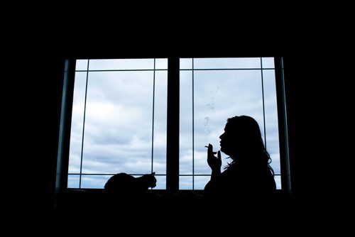 MIKAELA MACKENZIE / WINNIPEG FREE PRESS
A cannabis dealer smokes a joint in Winnipeg on Saturday, Oct. 13, 2018. 
Winnipeg Free Press 2018.