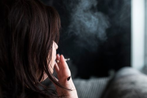 MIKAELA MACKENZIE / WINNIPEG FREE PRESS
A cannabis dealer smokes a joint in Winnipeg on Saturday, Oct. 13, 2018. 
Winnipeg Free Press 2018.