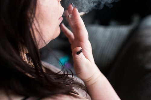 MIKAELA MACKENZIE / WINNIPEG FREE PRESS
A cannabis dealer smokes a joint in Winnipeg on Saturday, Oct. 13, 2018. 
Winnipeg Free Press 2018.