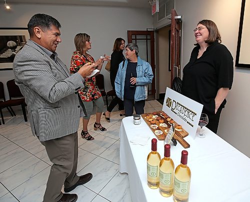 JASON HALSTEAD / WINNIPEG FREE PRESS

L-R: Alfred Lea (president, Native Canadian Chip Corporation) tries out chocolate hazelnut spread from Helen Staines of Decadence Chocolates during the 12th Great Manitoba Food Fight on Sept. 19, 2018 at De Lucas Cooking Studio. (See Social Page)