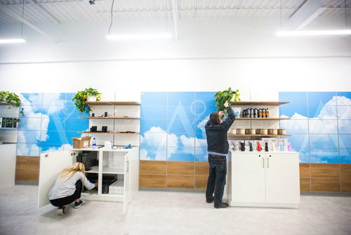 MIKAELA MACKENZIE / WINNIPEG FREE PRESS
Madison Lee (left) and Gary Symons stock shelves as the Delta 9 cannabis store prepares for opening day in Winnipeg on Tuesday, Oct. 16, 2018. 
Winnipeg Free Press 2018.