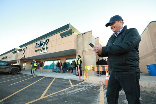 RUTH BONNEVILLE / WINNIPEG FREE PRESS

Cannabis customers  lineup outside Delta 9 Cannabis store on Dakota Street before it opens  at 10am Wednesday.

Gary Symons, Delta 9 Spokesperson stands outside store checking his stock in company on his phone on opening day Wednesday.

See Carol's story.


October 17, 2018