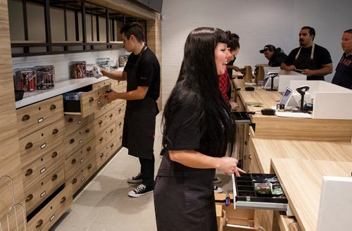 MIKE DEAL / WINNIPEG FREE PRESS
Customer service representatives at the Tweed store on Regent preparing customer purchases on the first day that cannabis can be sold legally in Canada.
181017 - Wednesday, October 17, 2018.