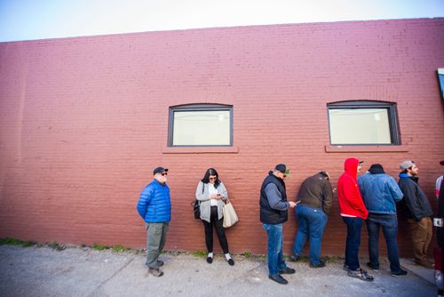 MIKAELA MACKENZIE / WINNIPEG FREE PRESS
Caitlin Turner, a mother of two and a recreational cannabis user, stands in line amongst many men at Tweed in Winnipeg on Wednesday, Oct. 17, 2018. 
Winnipeg Free Press 2018.