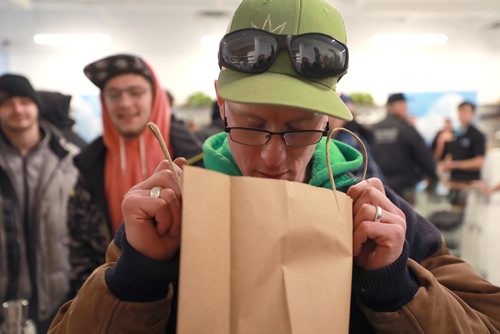 RUTH BONNEVILLE / WINNIPEG FREE PRESS

Delta 9 Cannabis store's 1st customer in line, Steven Stairs, who camped out in his tent from Tuesday evening takes a closer look and sniff of his purchases of cannabis after paying for his first order at Delta 9 Cannabis store on Dakota Street Wednesday.

See Carol's story.


October 17, 2018