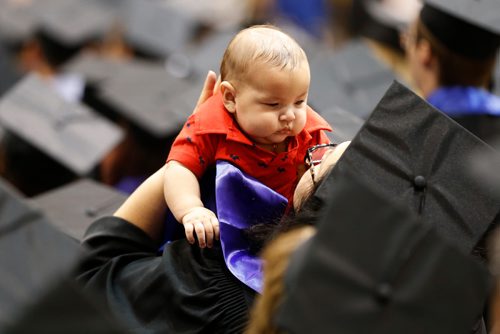 JOHN WOODS / WINNIPEG FREE PRESS
Angela Levasseur who was to receive her Post Baccalaureate Diploma in Education, holds her son Justin at the University of Manitoba 51st Convocation ceremony Wednesday, October 17, 2018.