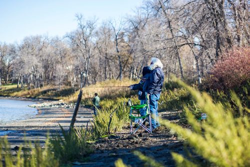 MIKAELA MACKENZIE / WINNIPEG FREE PRESS
Ron Tachnak and his son René enjoy the beautiful weather fishing on the Red River in St. Vital Park in Winnipeg on Thursday, Oct. 18, 2018. 
Winnipeg Free Press 2018.