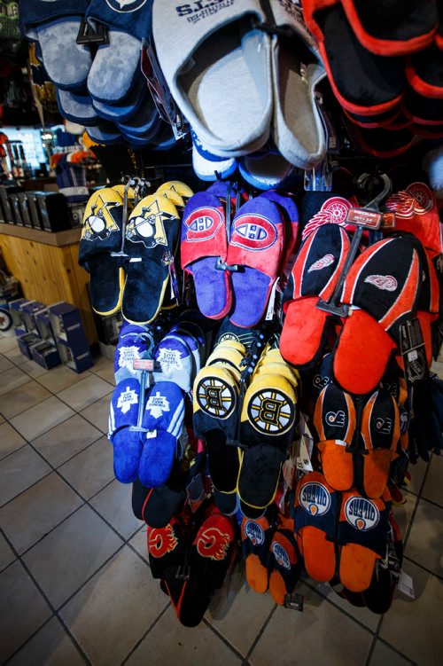 MIKE DEAL / WINNIPEG FREE PRESS
Most NHL teams are represented in the slipper rack at Uptown Sports which is on the 2nd level of Portage Place Shopping Centre and is celebrating its 15th anniversary in downtown Winnipeg.
181018 - Thursday, October 18, 2018.