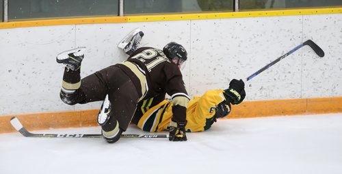 TREVOR HAGAN / WINNIPEG FREE PRESS
Manitoba Bisons' forward Brett Brooks (21) hits University of Regina Cougars Gray Marr (19) during first period Canada West hockey action, Friday, October 19, 2018.