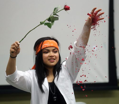 TREVOR HAGAN / WINNIPEG FREE PRESS
Kristine Macalinao, assistant coordinator for Let's Talk Science, and a 4th year genetics student crumbling a rose she froze with liquid nitrogen during a magic show during the Spooky Science event at the University of Manitoba, Saturday, October 20, 2018.