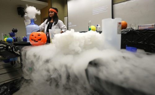 TREVOR HAGAN / WINNIPEG FREE PRESS
Kristine Macalinao, assistant coordinator for Let's Talk Science, and a 4th year genetics student performing a magic show during the Spooky Science event at the University of Manitoba, Saturday, October 20, 2018.
