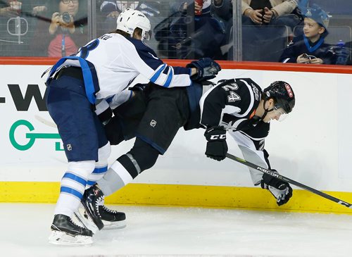 JOHN WOODS / WINNIPEG FREE PRESS
Manitoba Moose Sami Niku (8) checks by San Antonio Rampage's Klim Kostin (24) during first period AHL action in Winnipeg on Monday, October 21, 2018.