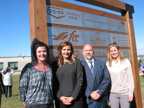 Canstar Community News Oct. 17, 2018 - (From left) Sanford Community Greenspace project co-chairs Carolyn Krawitz, Sarah Bestlabd and Christine Kabernick with J.A. Cuddy School principal Scott Thomson stand in front of the donor board listing the agencies and businesses that provided grants for the greenspace project. The other side of the baord includes individuals and business donors that contributed to the $240,000 project. (ANDREA GEARY/CANSTAR COMMUNITY NEWS)