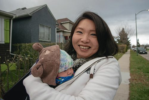 Canstar Community News Oct. 16 - Winnipeg School Division trustee candidate Yijie Chen holds her two-month old Sophia Jacks while door-knocking in the West End. (EVA WASNEY/CANSTAR COMMUNITY NEWS/METRO)