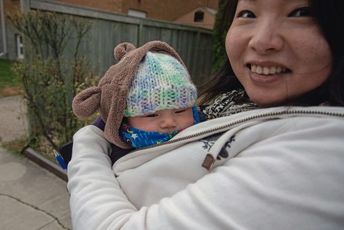 Canstar Community News Oct. 16 - Winnipeg School Division trustee candidate Yijie Chen holds her two-month old Sophia Jacks while door-knocking in the West End. (EVA WASNEY/CANSTAR COMMUNITY NEWS/METRO)