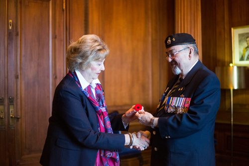 MIKAELA MACKENZIE / WINNIPEG FREE PRESS
Lieutenant-Governor Janice Filmon is presented with the first poppy of this years annual Royal Canadian Legion fundraiser by Comrade Ronn Anderson at the Manitoba Legislative Building in Winnipeg on Tuesday, Oct. 23, 2018. 
Winnipeg Free Press 2018.