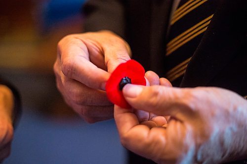 MIKAELA MACKENZIE / WINNIPEG FREE PRESS
Lieutenant-Governor Janice Filmon is presented with the first poppy of this years annual Royal Canadian Legion fundraiser by Comrade Ronn Anderson at the Manitoba Legislative Building in Winnipeg on Tuesday, Oct. 23, 2018. 
Winnipeg Free Press 2018.