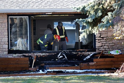 JOHN WOODS / WINNIPEG FREE PRESS
Emergency personnel were called to remove a car from the living room at 236 Handsart Blvd Tuesday, October 23, 2018.
An SUV drove through the front of a home on the 200 block of Handsart Boulevard Tuesday afternoon. Police were dispatched to the scene at 2:15 p.m. While there was extensive damage to the home, no one was injured in the incident.