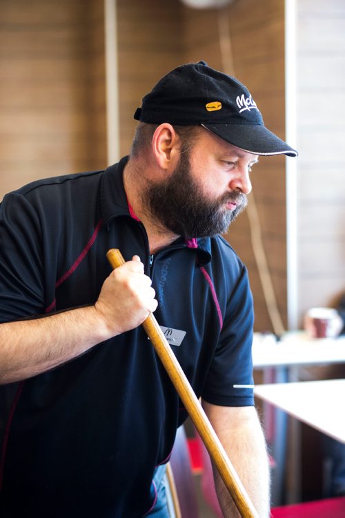 MIKAELA MACKENZIE / WINNIPEG FREE PRESS
Edward Case, an adult living with special needs, cleans tables and mops floors at McDonald's in Winnipeg on Wednesday, Oct. 24, 2018. 
Winnipeg Free Press 2018.