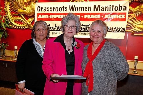 BORIS MINKEVICH / WINNIPEG FREE PRESS 090308 Laverne Contoir and Gisele Roch flank award winner Frances Russell at the International Women's Day third annual awards dinner.