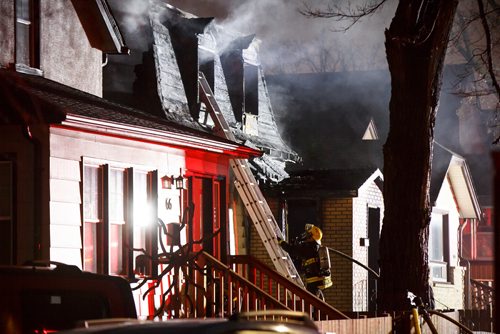 MIKE DEAL / WINNIPEG FREE PRESS
Winnipeg Fire Paramedic Service personnel work at putting out a house fire at 68 Prince Edward St. in the Point Douglas neighbourhood where two people are missing and may have died in the fire early Friday morning.
181026 - Friday, October 26, 2018.