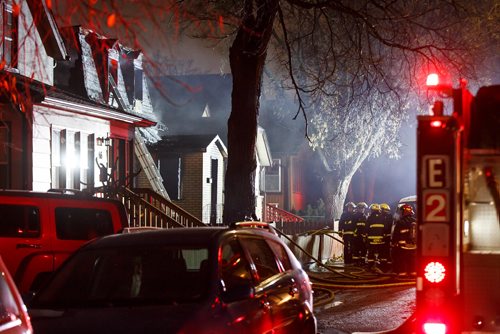 MIKE DEAL / WINNIPEG FREE PRESS
Winnipeg Fire Paramedic Service personnel work at putting out a house fire at 68 Prince Edward St. in the Point Douglas neighbourhood where two people are missing and may have died in the fire early Friday morning.
181026 - Friday, October 26, 2018.