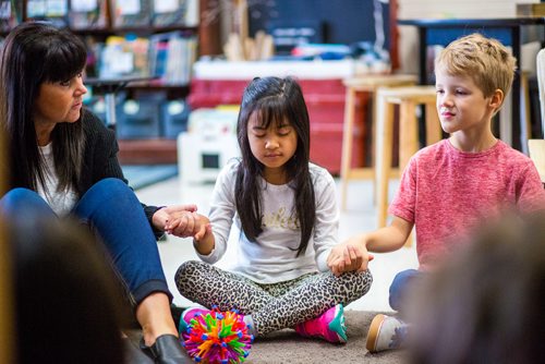 MIKAELA MACKENZIE / WINNIPEG FREE PRESS
Rhiane Cadangan concentrates on passing a positive thought along the circle during a mindfulness activity at Sargent Park School in Winnipeg on Thursday, Oct. 25, 2018. 
Winnipeg Free Press 2018.