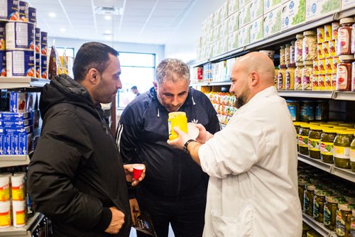 MIKAELA MACKENZIE / WINNIPEG FREE PRESS
Murhaf Abdul Karim shows customers ghee at Blady Middle Eastern market opens in Winnipeg on Friday, Oct. 26, 2018. 
Winnipeg Free Press 2018.