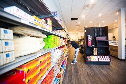 MIKAELA MACKENZIE / WINNIPEG FREE PRESS
Youssef Ahmed puts price stickers up before Blady Middle Eastern market opens in Winnipeg on Friday, Oct. 26, 2018. 
Winnipeg Free Press 2018.