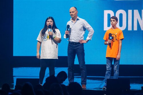 MIKE DEAL / WINNIPEG FREE PRESS
Winter Ross from Juniper School in Thompson, Manitoba and Gabriel Maitre from Ecole Lacerte School in Winnipeg with the Editor of the Winnipeg Free Press, Paul Samyn speak to around 16,000 kids from across Manitoba who are attending WE Day at Bell MTS Place where they were celebrating young people committed to making a difference.
181030 - Tuesday, October 30, 2018.