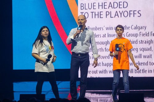 MIKE DEAL / WINNIPEG FREE PRESS
Winter Ross from Juniper School in Thompson, Manitoba and Gabriel Maitre from Ecole Lacerte School in Winnipeg with the Editor of the Winnipeg Free Press, Paul Samyn speak to around 16,000 kids from across Manitoba who are attending WE Day at Bell MTS Place where they were celebrating young people committed to making a difference.
181030 - Tuesday, October 30, 2018.