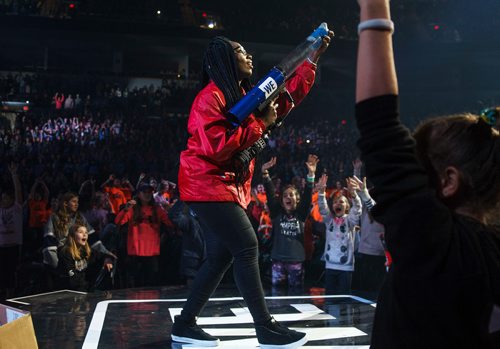 MIKE DEAL / WINNIPEG FREE PRESS
One of the DJ hosts, Lissa Monet prepares to fire t-shirts into the crowd of around 16,000 kids from across Manitoba who are attending WE Day at Bell MTS Place where they were celebrating young people committed to making a difference.
181030 - Tuesday, October 30, 2018.