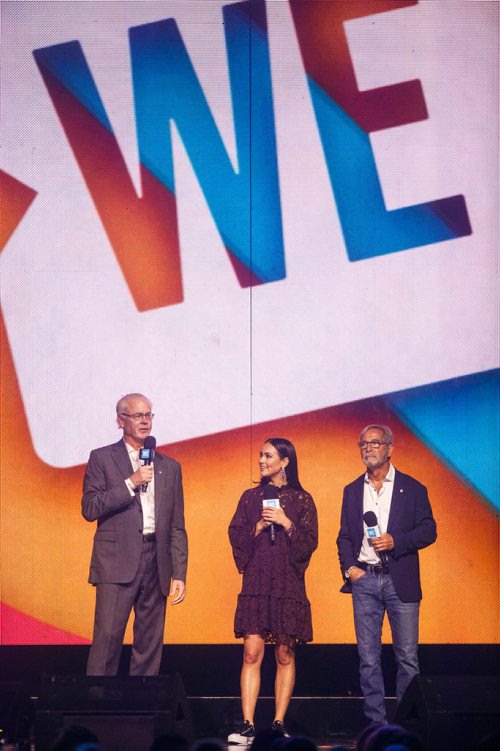 MIKE DEAL / WINNIPEG FREE PRESS
Hartley Richardson (left), CEO and president of James Richardson & Sons with WE Day host Chloe Wilde (centre) and Bob Silver (right), president of Western Glove Works as well as general partner of FP Canadian Newspapers Limited Partnership speaks to around 16,000 kids from across Manitoba who are attending WE Day at Bell MTS Place where they were celebrating young people committed to making a difference.
181030 - Tuesday, October 30, 2018.